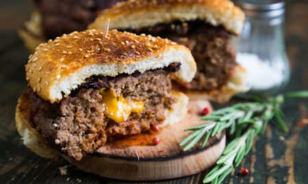 Spicy cheddar stuffed burgers national cheeseburger day