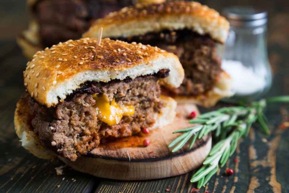 Spicy cheddar stuffed burgers national cheeseburger day